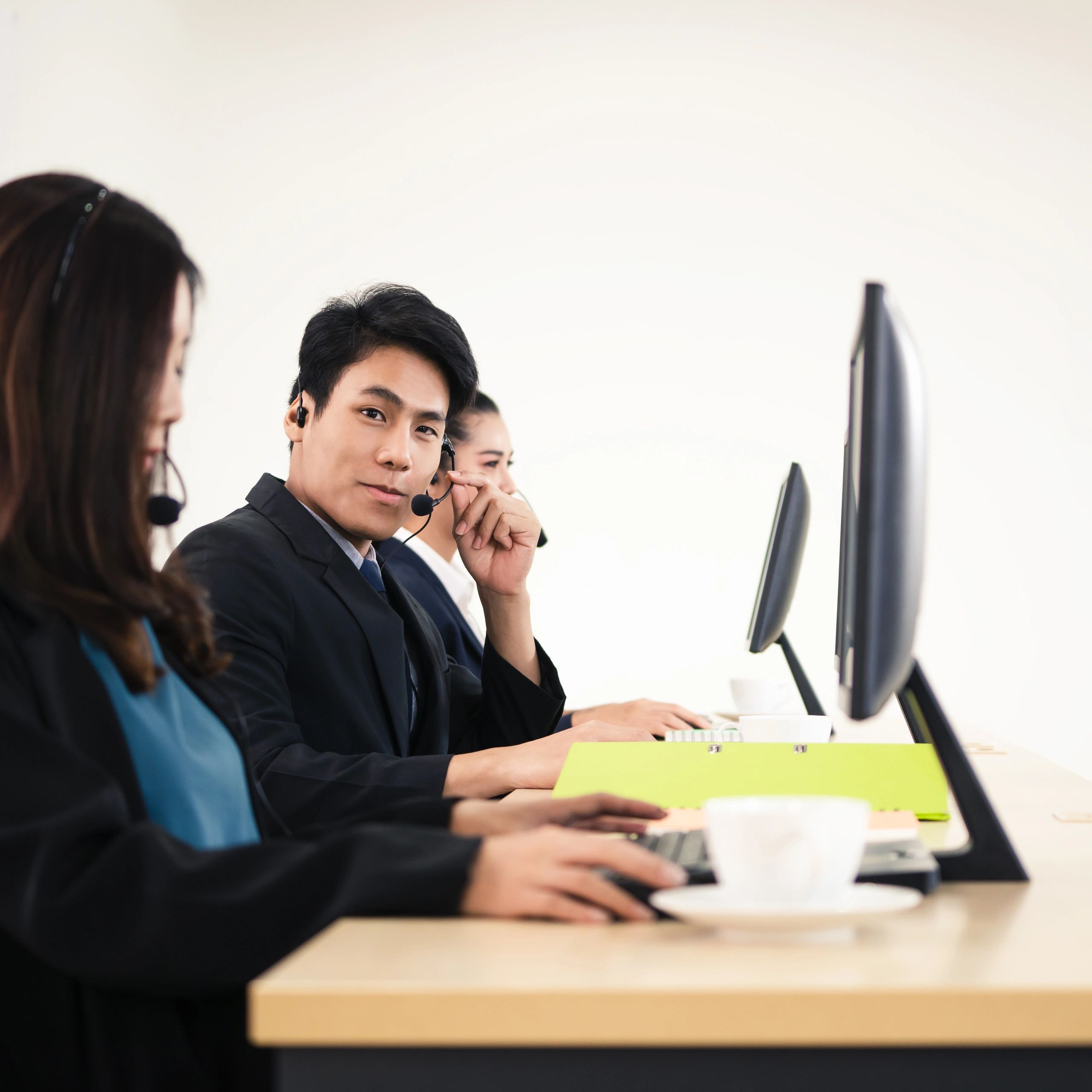 Help desk support team wearing headsets